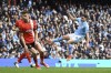 Manchester City's Julian Alvarez, right, makes an attempt to score during the English Premier League soccer match between Manchester City and Luton Town at Etihad stadium in Manchester, England, Saturday, April 13, 2024. (AP Photo/Rui Vieira)