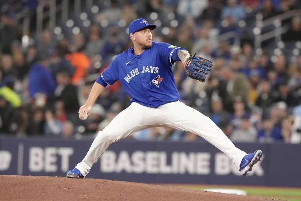 Toronto Blue Jays starting pitcher Yariel Rodriguez throws his first Major League pitch against Colorado Rockies during inning interleague MLB baseball action in Toronto, Saturday, April 13, 2024. THE CANADIAN PRESS/Chris Young