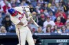 Philadelphia Phillies' Nick Castellanos hits an RBI single during the first inning of a baseball game against the Pittsburgh Pirates, Saturday, April 13, 2024, in Philadelphia. (AP Photo/Laurence Kesterson)