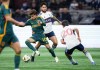 Los Angeles Galaxy's Riqui Puig (10) evades Vancouver Whitecaps' Ryan Raposo, back centre, and Andres Cubas (20) during the first half of an MLS soccer match, in Vancouver, on Saturday, April 13, 2024. THE CANADIAN PRESS/Darryl Dyck