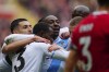Crystal Palace's Eberechi Eze, centre, celebrates after scoring his side's opening goal during the English Premier League soccer match between Liverpool and Crystal Palace at Anfield Stadium in Liverpool, England, Sunday, April 14, 2024. (AP Photo/Jon Super)