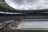 The purple athletics track at the Olympic Stadium, currently known as Stade de France, is being installed, in Saint-Denis, north of Paris, Tuesday, April 9, 2024. The Olympic Stadium will host the athletics events at the Paris 2024 Olympic Games. (AP Photo/Aurelien Morissard)