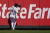 Seattle Mariners left fielder Dominic Canzone collides with the wall after catching a fly ball hit by Chicago Cubs' Mike Tauchman during the second inning of a baseball game Sunday, April 14, 2024, in Seattle. Canzone would leave the game due to injury after the play. (AP Photo/Lindsey Wasson)