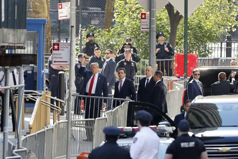 Former President Donald Trump arrives at Manhattan criminal court with his legal team, Monday, April 15, 2024, in New York. The hush money trial of former President Donald Trump begins Monday with jury selection. It's a singular moment for American history as the first criminal trial of a former U.S. commander in chief. (AP Photo/Stefan Jeremiah)