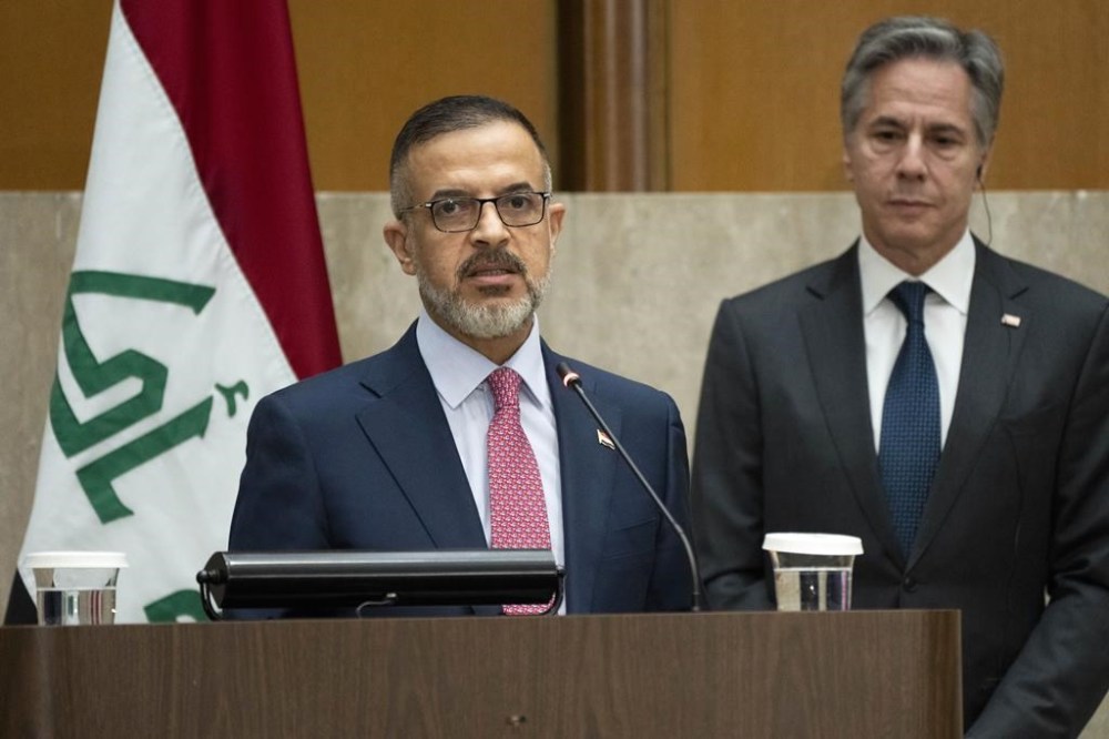 Iraq's Deputy Prime Minister Muhammad Ali Tamim speaks as Secretary of State Antony Blinken listens at the start of a U.S.-Iraq Higher Coordinating Committee meeting, Monday, April 15, 2024, at the State Department in Washington. (AP Photo/Jacquelyn Martin)