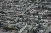 Home sales in British Columbia fell by almost 10 per cent in March compared with the same period last year, in a slowdown an analyst says could be buyers waiting for lower interest rates. Houses are seen in an aerial view in a residential neighbourhood, in Kamloops, B.C., Monday, Sept. 11, 2023. THE CANADIAN PRESS/Darryl Dyck