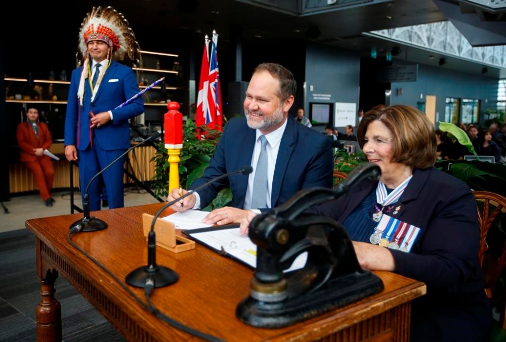 Manitoba Premier Wab Kinew looks on as Matt Wiebe, Minister of Justice and Attorney General, Keeper of the Great Seal of the Province of Manitoba, Minister responsible for the Manitoba Public Insurance Corporation is sworn-in by Lt. Gov. Anita Neville at a Premier and cabinet swearing-in ceremony in Winnipeg, Wednesday, Oct. 18, 2023. THE CANADIAN PRESS/John Woods