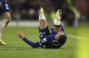 Chelsea's Cole Palmer lies on the pitch in pain during the English Premier League soccer match between Chelsea and Everton at Stamford Bridge stadium in London, Monday, April 15, 2024. (AP Photo/Ian Walton)