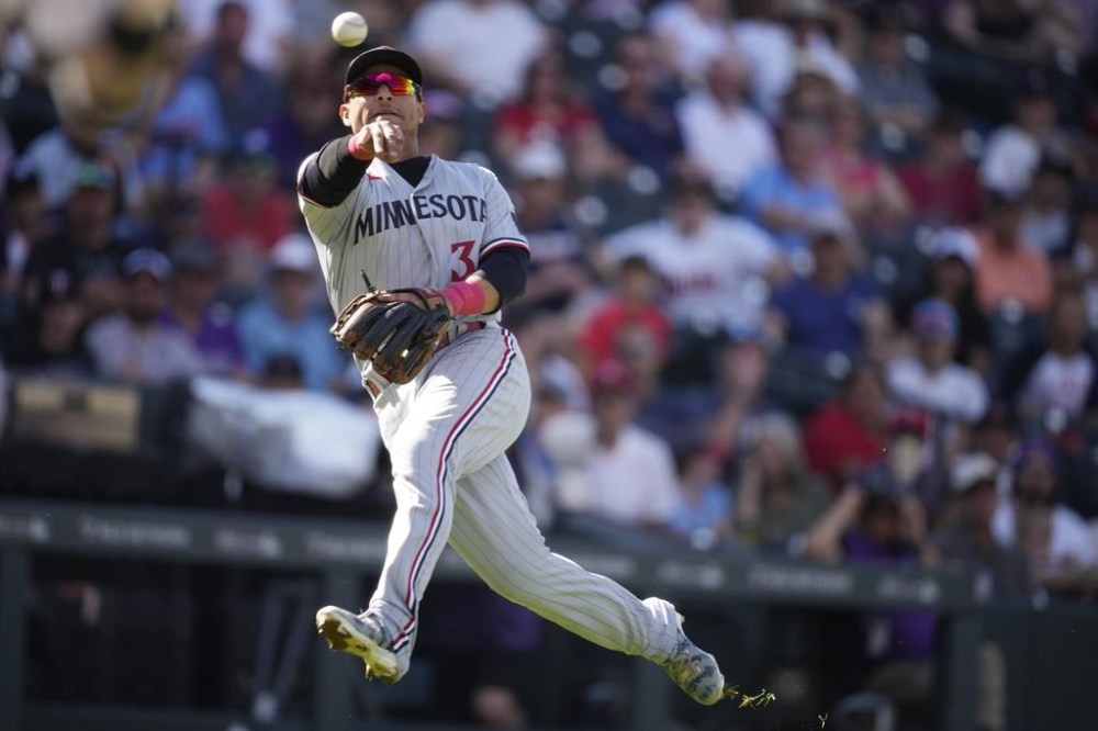 FILE - Minnesota Twins third baseman Donovan Solano throws in the sixth inning of a baseball game, Oct. 1, 2023, in Denver. Solano has signed a minor league deal with the San Diego Padres in an announcement Monday, April 15, 2024. (AP Photo/David Zalubowski, File)