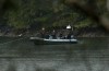 Fisheries Department Pacific region marine mammal co-ordinator Paul Cottrell operates a zodiac with other experts as they conduct work in an area where an orphaned two-year-old female orca calf continues to live in a lagoon near Zeballos, B.C., on Thursday, April 11, 2024. The Department of Fisheries says planning for a new attempt to rescue an orca calf trapped in a Vancouver Island lagoon will be finalized in the next few days but no date has been set THE CANADIAN PRESS/Chad Hipolito