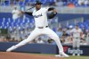 Miami Marlins pitcher Edward Cabrera aims a pitch during the first inning of a baseball game against the San Francisco Giants, Monday, April 15, 2024, in Miami. (AP Photo/Marta Lavandier)