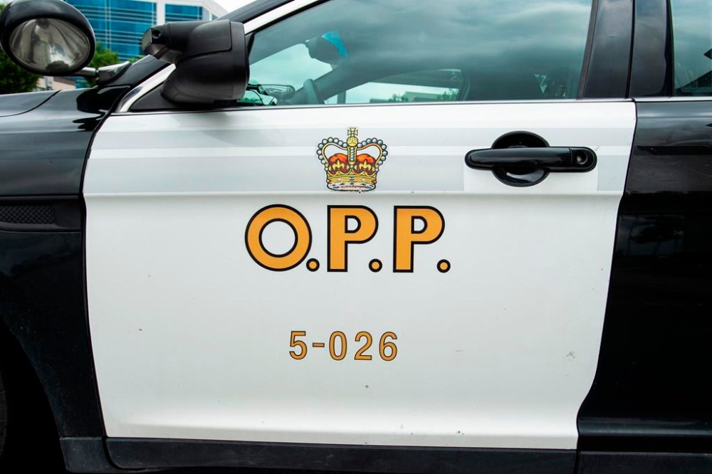 An Ontario Provincial Police cruiser sits outside of a press conference in Vaughan, Ont., on Thursday, June 20, 2019. Teams of searchers have been looking for a motorist missing since the weekend when police say the vehicle he was driving entered a flooded ditch and was pulled into a creek in northern Ontario. THE CANADIAN PRESS/Andrew Lahodynskyj