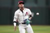 Arizona Diamondbacks' Ketel Marte fields a ground out hit by Chicago Cubs' Nico Hoerner during the fourth inning of a baseball game, Monday, April 15, 2024, in Phoenix. (AP Photo/Matt York)