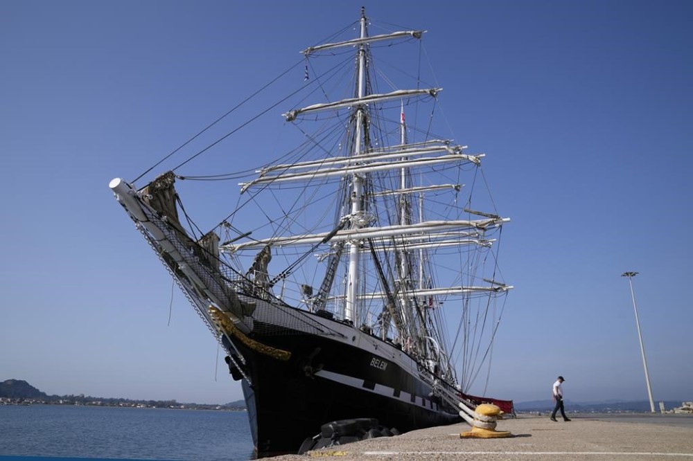 The Commandant of the historic Belem ship Aymeric Gibet, walks at the port of Katakolo, about 311 kilometers (194 miles) southwest of Athens, Greece, Monday, April 15, 2024. Built the same year the first modern Olympics were staged in Athens, in 1896, the Belem will carry the flame for the Paris games from the Greek capital's port of Piraeus to Marseille -- a former ancient Greek colony in southern France. (AP Photo/Thanassis Stavrakis)