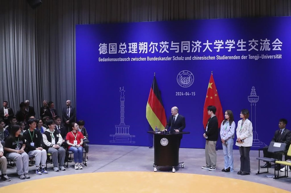 In this photo released by Xinhua News Agency, German Chancellor Olaf Scholz takes part in a dialogue with students at Tongji University's Jiading Campus in Shanghai, China, Monday, April 15, 2024. German Chancellor Olaf Scholz has called for fair competition in trade relations with China while warning about dumping and overproduction while speaking to students in Shanghai on Monday. (Fang Zhe/Xinhua via AP)