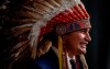 Manitoba Premier Wab Kinew speaks at a premier and cabinet swearing-in ceremony in Winnipeg, Wednesday, Oct. 18, 2023. New figures show Manitoba New Democrats raised and spent more money than the Progressive Conservatives in last year's election campaign. THE CANADIAN PRESS/John Woods