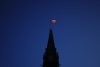 The Canada flag catches the morning light on the Peace Tower on Parliament Hill in Ottawa on Tuesday, April 16, 2024. THE CANADIAN PRESS/Sean Kilpatrick