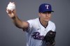 FILE - Texas Rangers pitcher Jack Leiter poses in Surprise, Ariz., Feb. 20, 2024. Jack Leiter, the 23-year-old son of former major league pitcher Al Leiter, is to make his major league debut for the Texas Rangers against the Detroit Tigers on Thursday, April 18. (AP Photo/Carolyn Kaster, File)