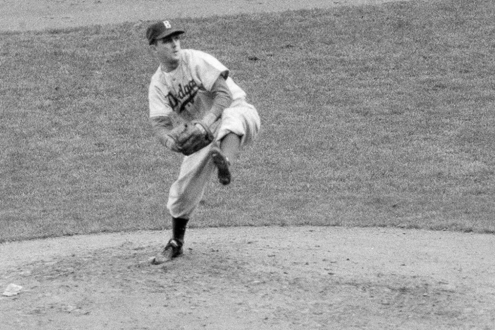 FILE - Brooklyn Dodgers' Carl Erskine pitches against the New York Yankees in Game 5 of the baseball World Series in New York, Oct. 5, 1952. Carl Erskine, who pitched two no-hitters as a mainstay on the Brooklyn Dodgers and was a 20-game winner in 1953 when he struck out a then-record 14 in the World Series, died Tuesday, April 16, 2024, at Community Hospital Anderson in Anderson, Indiana, according to Michele Hockwalt, the hospital’s marketing and communication manager. He was 97. (AP Photo, File)