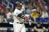 FILE -Miami Marlins' Yuli Gurriel hits a single to score Josh Bell during the ninth inning of a baseball game against the New York Mets, Wednesday, Sept. 20, 2023, in Miami. Former AL batting champion Yuli Gurriel finalized a minor league contract with the Atlanta Braves on Tuesday, April 16, 2024 and was assigned to Triple-A Gwinnett.(AP Photo/Lynne Sladky, File)
