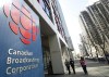 People walk into the CBC building in Toronto on April 4, 2012. The CBC is welcoming a one-year investment of $42 million in Tuesday's federal budget which it says will help the organization avoid major staff cuts. THE CANADIAN PRESS/Nathan Denette