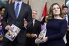 Prime Minister Justin Trudeau, left, and Deputy Prime Minister and Minister of Finance Chrystia Freeland hold copies of the federal budget as they pose for a photo before its tabling, on Parliament Hill in Ottawa, on Tuesday, April 16, 2024. THE CANADIAN PRESS/Justin Tang