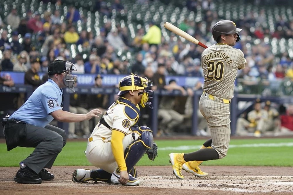 San Diego Padres' Kyle Higashioka hits a double during the third inning of a baseball game against the Milwaukee Brewers Wednesday, April 17, 2024, in Milwaukee. (AP Photo/Morry Gash)
