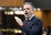 Health Minister Mark Holland rises during Question Period on April 16, 2024 in Ottawa.  THE CANADIAN PRESS/Adrian Wyld