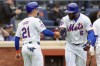 New York Mets' Starling Marte (6) celebrates with Zack Short (21) after they scored off of Marte's a two-run home run during the third inning of a baseball game against the Pittsburgh Pirates, Wednesday, April 17, 2024, in New York. (AP Photo/Mary Altaffer)