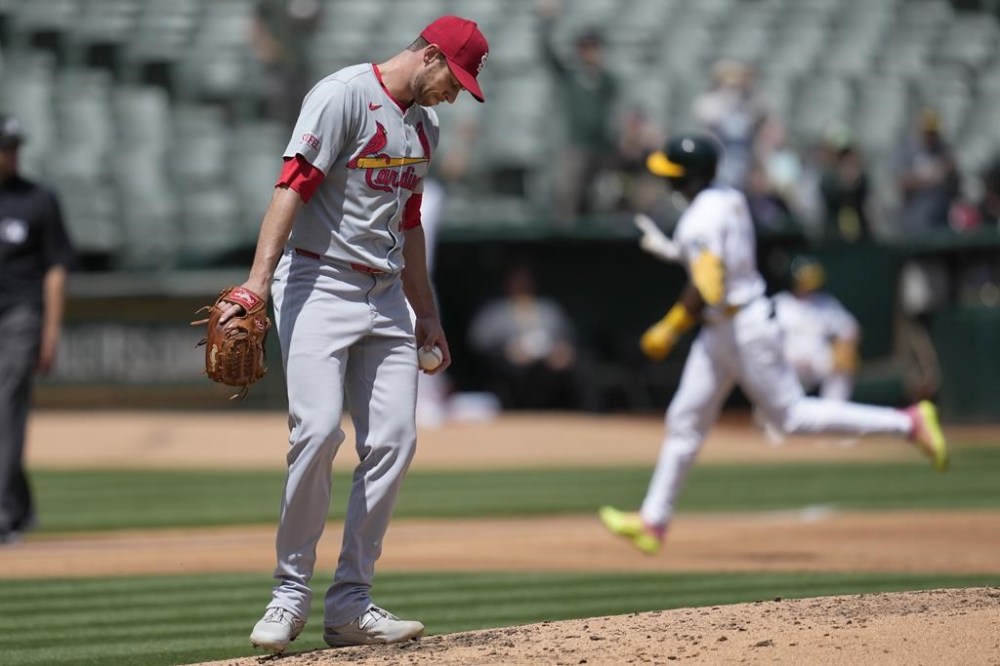 St. Louis Cardinals pitcher Steven Matz, left, reacts as Oakland Athletics' Esteury Ruiz, right rear, rounds the bases after hitting a two-run home run during the third inning of a baseball game in Oakland, Calif., Wednesday, April 17, 2024. (AP Photo/Jeff Chiu)