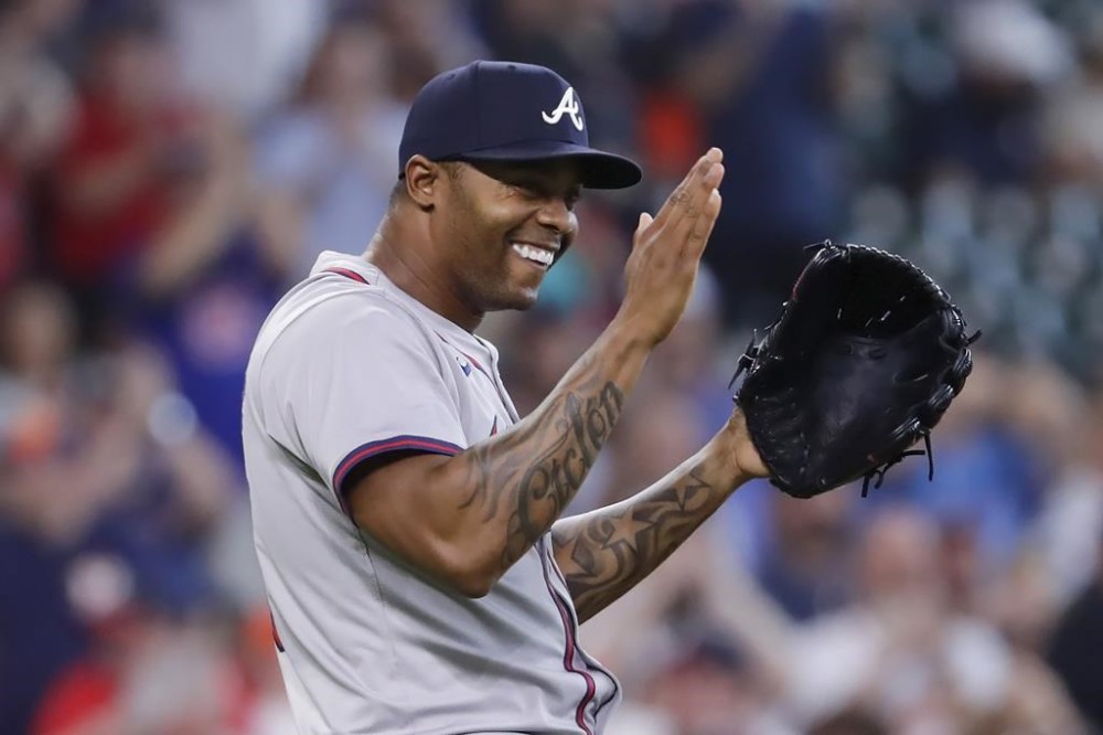 Atlanta Braves closing pitcher Raisel Iglesias celebrates after a baseball game against the Houston Astros, Wednesday, April 17, 2024, in Houston. The Braves won 5-4 in 10 innings. (AP Photo/Michael Wyke)