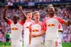 From left, Leipzig's players Amadou Haidara, Willi Orban, scorer Dani Olmo and Mohamed Simakan celebrate the opening goal during the German Bundesliga soccer match between RB Leipzig and VfL Wolfsburg in Leipzig, Germany, Saturday, April 13, 2024. (Jan Woitas/dpa via AP)