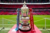 FILE - The FA Cup trophy is seen before the English FA Cup final soccer match between Manchester City and Manchester United at Wembley Stadium in London, Saturday, June 3, 2023. FA Cup replays have for so long been a big money-maker for lower-division teams in English soccer but they are being scrapped from next season. Organizers are citing “expanded UEFA competitions” as a reason for the move. (AP Photo/Jon Super, File)