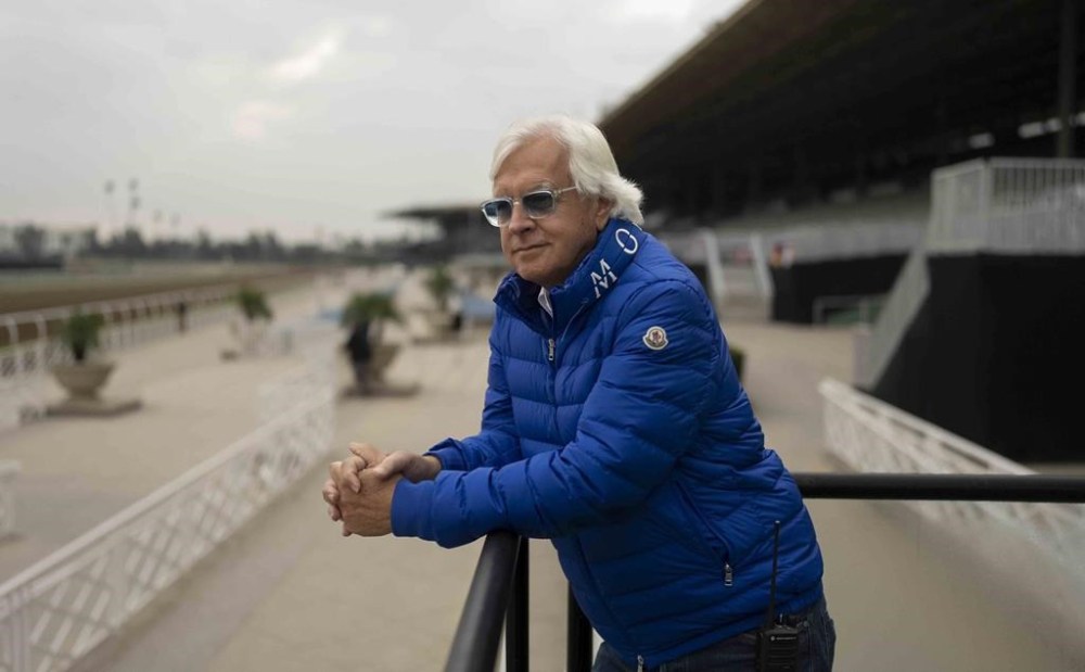 FILE - Trainer Bob Baffert stands for a photo ahead of the Breeders' Cup horse races at Santa Anita in Arcadia, Calif., Oct. 27, 2023. A judge has denied a request by the owner of Baffert-trained Arkansas Derby winner Muth for the colt to run in next month’s 150th Kentucky Derby at Churchill Downs. Jefferson County (Ky.) Circuit Judge Mitch Perry declined Thursday, April 18, to grant a temporary injunction to Zedan Racing Stables, which had argued that the ban of Baffert was “illegal.” (AP Photo/Jae C. Hong, File)