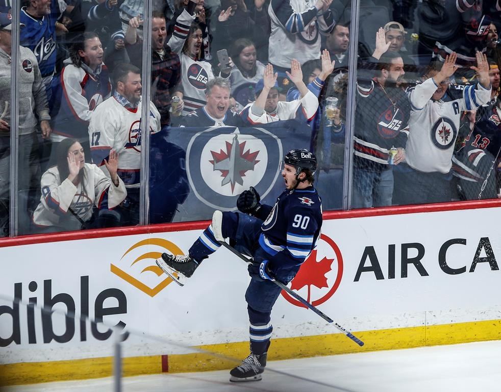 Winnipeg Jets' Nikita Chibrikov (90) celebrates his game-winning goal against the Vancouver Canucks during third period NHL action in Winnipeg on Thursday, April 18, 2024. THE CANADIAN PRESS/John Woods