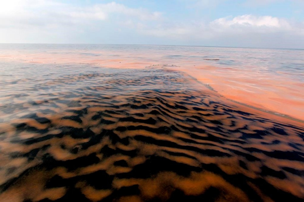 FILE - Oil makes a pattern in the waters of Chandeleur Sound, La., May 6, 2010. (AP Photo/Alex Brandon, File)