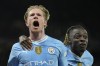 Manchester City's Kevin De Bruyne, left, celebrates after scoring his side's opening goal during the Champions League quarterfinal second leg soccer match between Manchester City and Real Madrid at the Etihad Stadium in Manchester, England, Wednesday, April 17, 2024. (AP Photo/Dave Shopland)