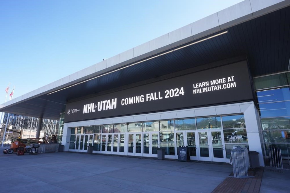 Signage announces that an NHL team is coming to Salt Lake City, at the Delta Center on Thursday, April 18, 2024, in Salt Lake City. The NHL team moving from Arizona to Salt Lake City will be known as Utah, at least initially. New owner Ryan Smith says the name will begin with Utah and he does not want to rush the process of rebranding the franchise upon relocation. (AP Photo/Rick Bowmer)