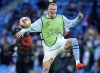 Manchester City's Erling Haaland warms up ahead of the Champions League quarterfinal second leg soccer match between Manchester City and Real Madrid at the Etihad Stadium in Manchester, England, Wednesday, April 17, 2024. (AP Photo/Dave Thompson)