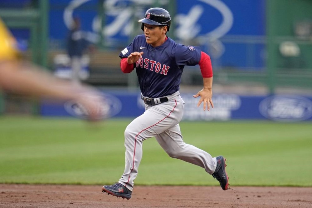 Boston Red Sox's Masataka Yoshida attempts to score from first on a double by Bobby Dalbec off Pittsburgh Pirates starting pitcher Quinn Priester during the second inning of a baseball game in Pittsburgh, Friday, April 19, 2024. Yoshida was tagged out at the plate. (AP Photo/Gene J. Puskar)