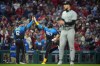 Philadelphia Phillies' Alec Bohm, center, celebrates with third base coach Dusty Wathan, left, after hitting a three-run home run against Chicago White Sox pitcher Garrett Crochet during the third inning of a baseball game, Friday, April 19, 2024, in Philadelphia. (AP Photo/Matt Slocum)