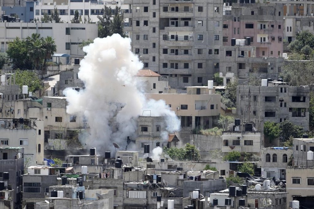 Smoke rises from an explosion during an Israeli military operation in the Nur Shams refugee camp, near the West Bank town of Tulkarem, Saturday, April 20, 2024. The raid killed at least four Palestinians, including three militants, according to the Israeli military, Palestinian health officials and the Islamic Jihad militant group. (AP Photo/Majdi Mohammed)