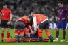 Barcelona's Frenkie de Jong reacts after getting injured during the Spanish La Liga soccer match between Real Madrid and Barcelona at the Santiago Bernabeu stadium in Madrid, Spain, Sunday, April 21, 2024. (AP Photo/Manu Fernandez)