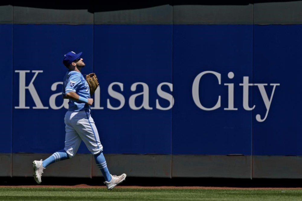 Kansas City Royals center fielder Garrett Hampson chases after a solo home run hit by Baltimore Orioles' Colton Cowser during the third inning of a baseball game Sunday, April 21, 2024, in Kansas City, Mo. (AP Photo/Charlie Riedel)