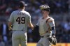 Detroit Tigers pitcher Alex Faedo (49) and catcher Jake Rogers, right, shake hands after their win over the Minnesota Twins of a baseball game Sunday, April 21, 2024, in Minneapolis. (AP Photo/Abbie Parr)