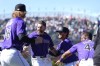 Colorado Rockies' Ryan McMahon, third from left, is congratulated by, from left to right, Nick Mears, Jake Cave and Elehuris Montero after hitting a walkoff RBI single in the 10th inning of the first game of a baseball doubleheader against the Seattle Mariners, Sunday, April 21, 2024, in Denver. (AP Photo/David Zalubowski)