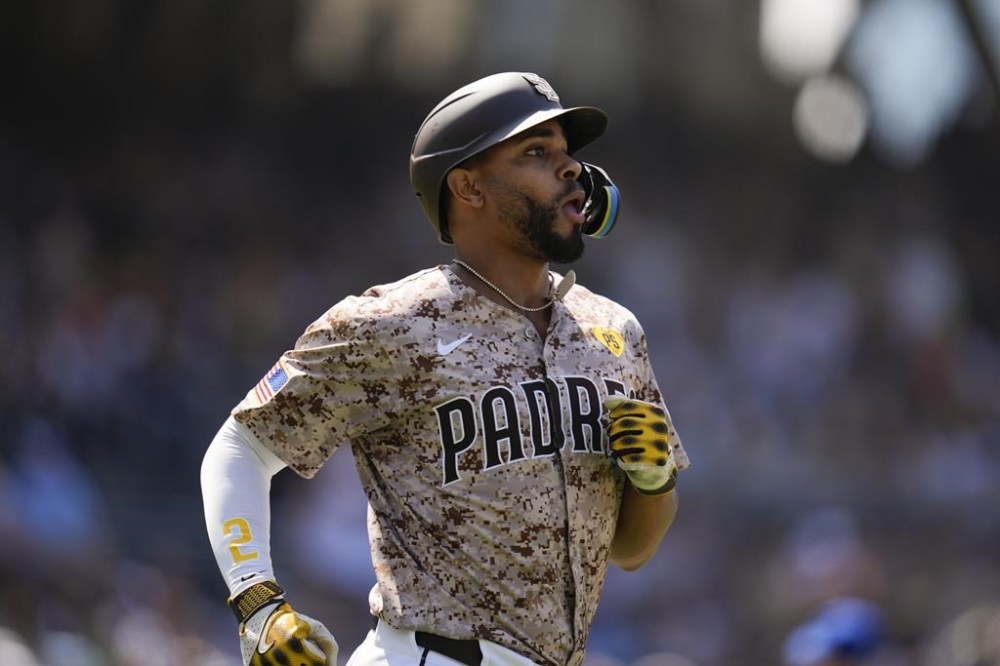 San Diego Padres' Xander Bogaerts watches as he flies out during the sixth inning of a baseball game against the Toronto Blue Jays, Sunday, April 21, 2024, in San Diego. (AP Photo/Gregory Bull)
