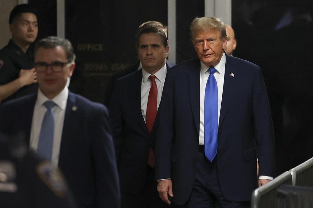 Former president Donald Trump arrives at Manhattan criminal court, Monday, April 22, 2024, in New York. Opening statements in Donald Trump's historic hush money trial are set to begin. Trump is accused of falsifying internal business records as part of an alleged scheme to bury stories he thought might hurt his presidential campaign in 2016. (AP Photo/Yuki Iwamura, Pool)
