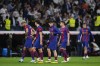 Barcelona players react as they leave the field at the end of the Spanish La Liga soccer match between Real Madrid and Barcelona at the Santiago Bernabeu stadium in Madrid, Spain, Sunday, April 21, 2024. (AP Photo/Manu Fernandez)