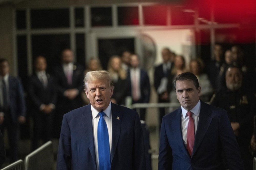Former President Donald Trump speaks to the media on the first day of opening arguments in his trial at Manhattan Criminal Court in New York, Monday, April 22, 2024. (Victor J. Blue/The Washington Post via AP, Pool)
